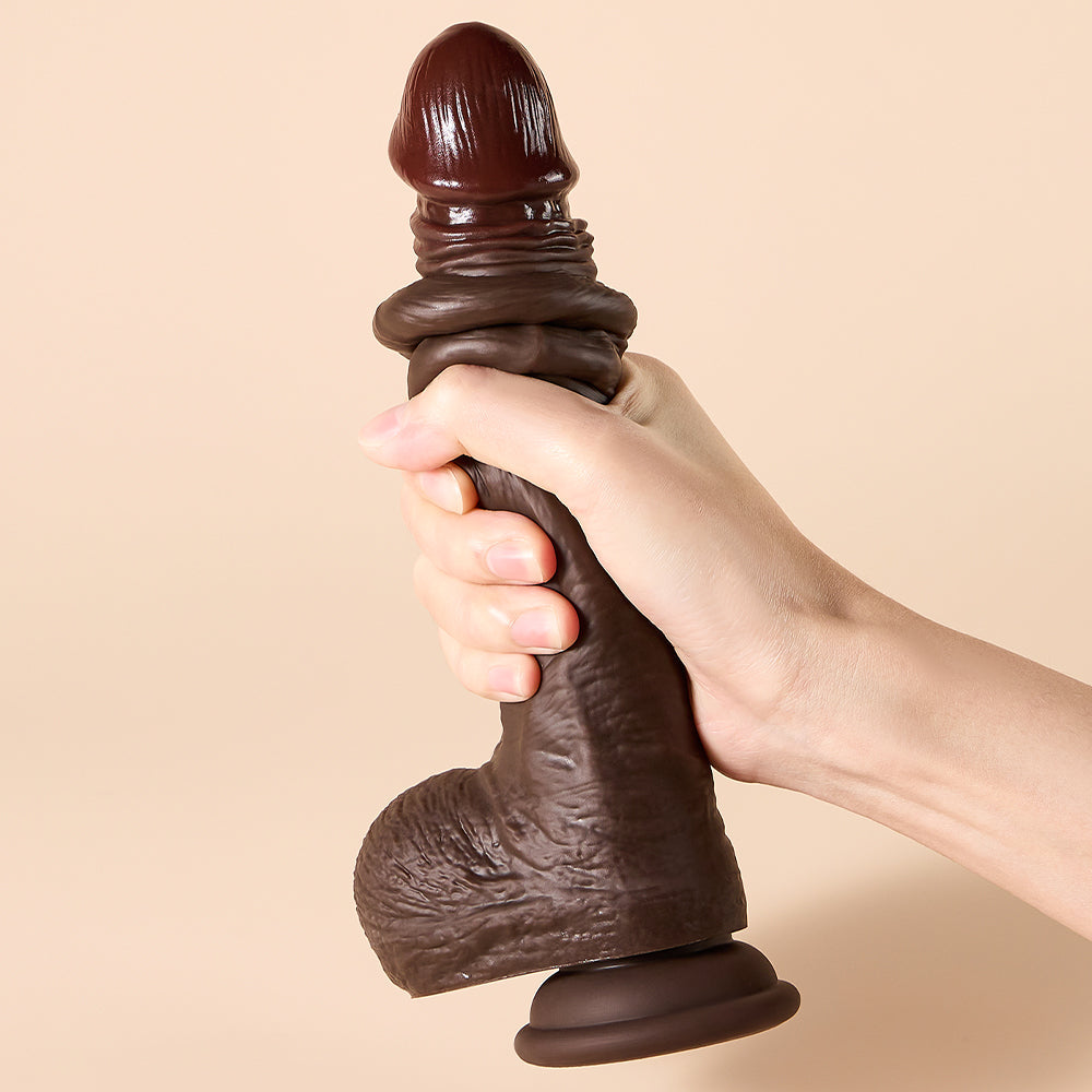 Joylume ObsidianCurve upright suction cup dildo displayed on flat surface