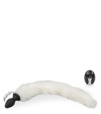 Vibrating butt plug with white synthetic fur tail